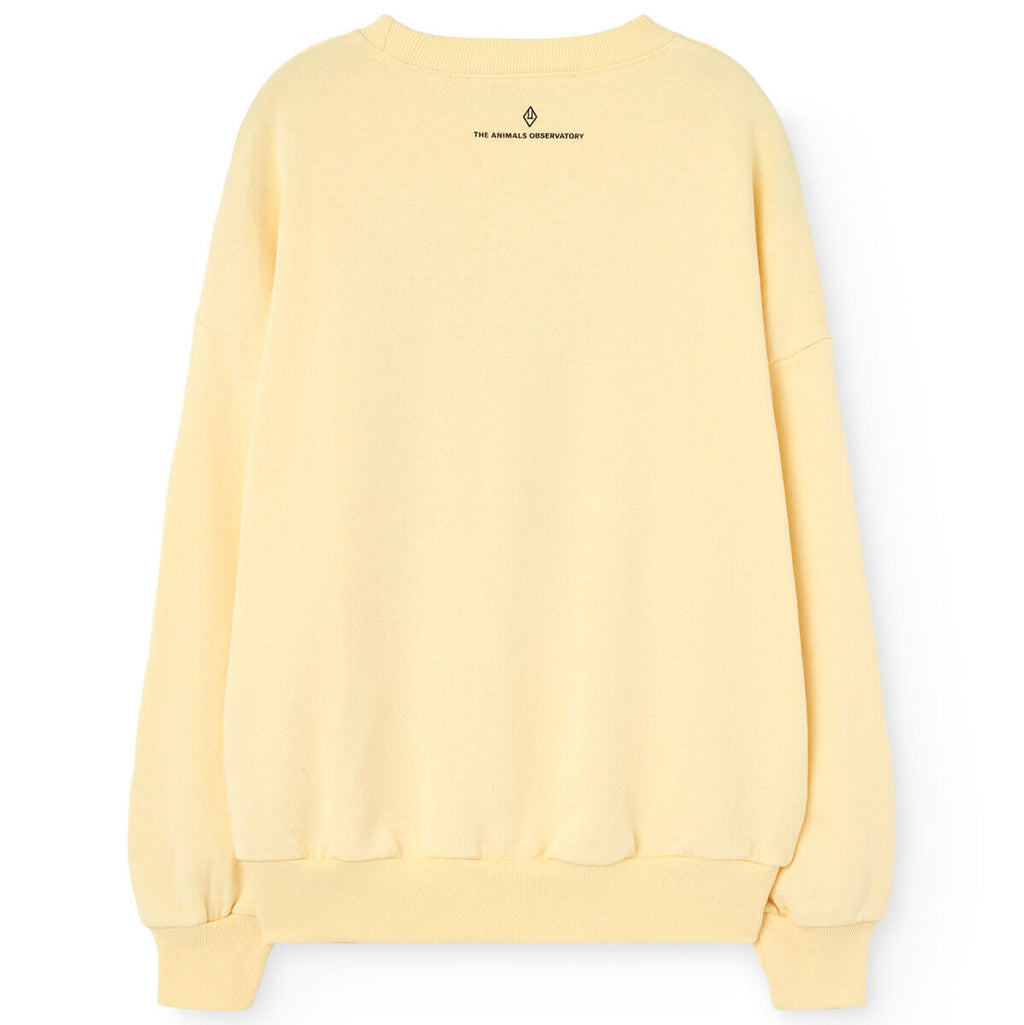 Sweat-shirt décontracté en coton biologique jaune pâle uni pour enfant avec poignets côtelés et coupe décontractée pour tout-petits