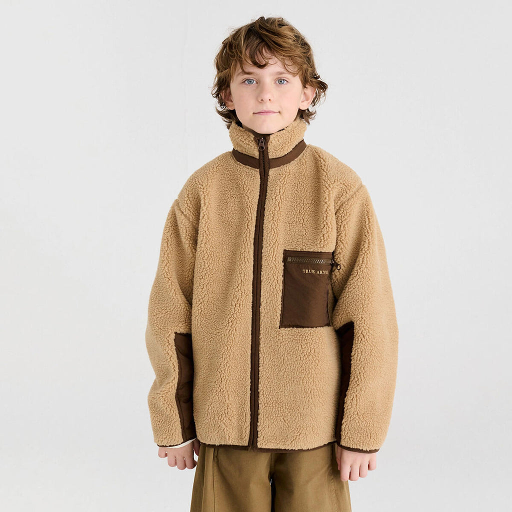 Veste réversible en polyester recyclé uni marron Sporty Otter avec deux options de style pour les enfants de 1 à 13 ans