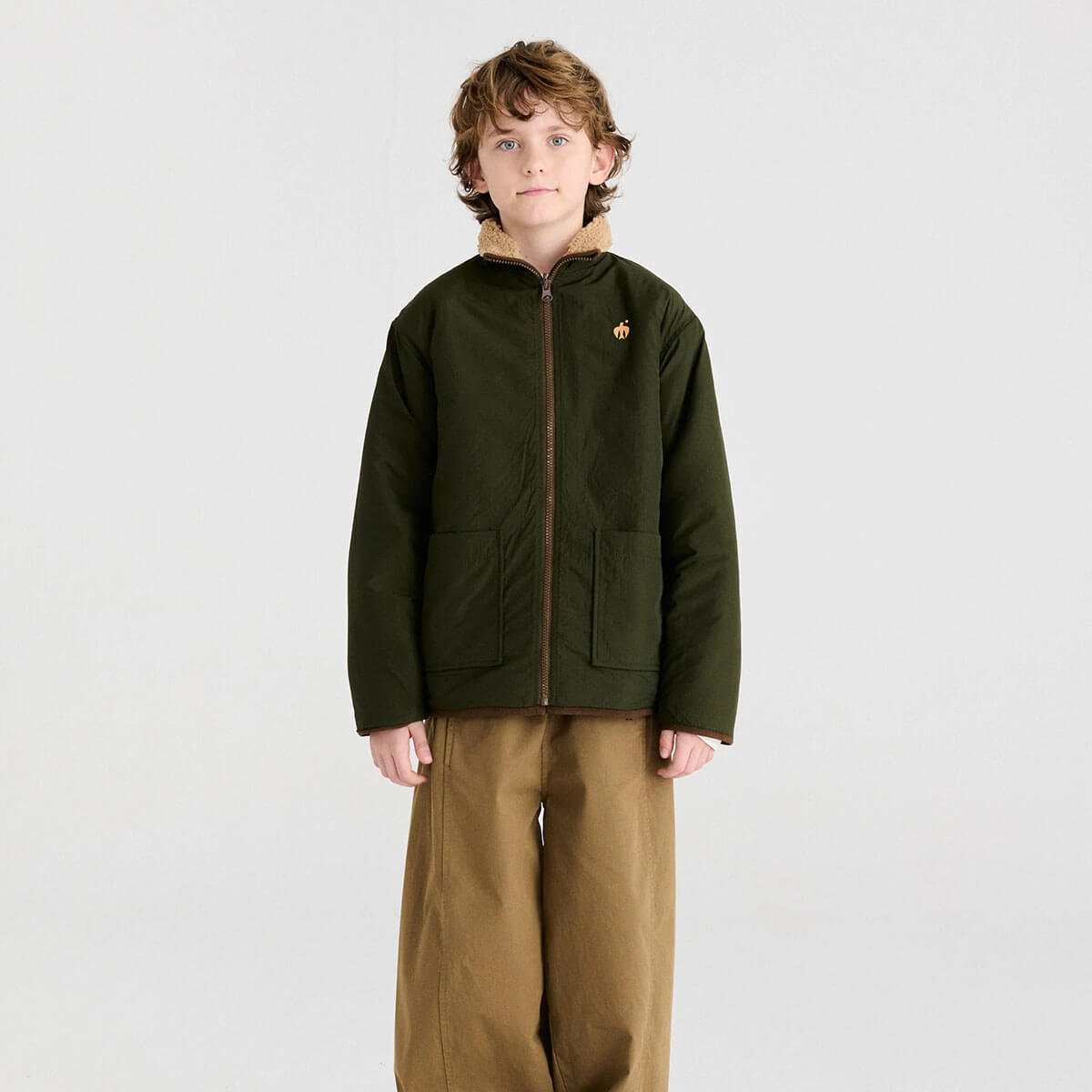 Veste réversible en polyester recyclé uni marron Sporty Otter avec deux options de style pour les enfants de 1 à 13 ans